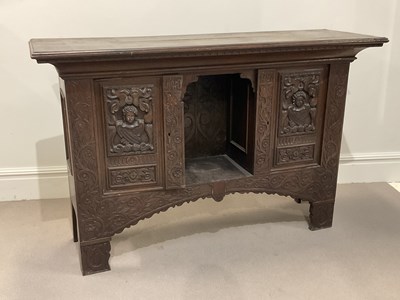Lot 1040 - A 19th century Continental carved oak cupboard,...