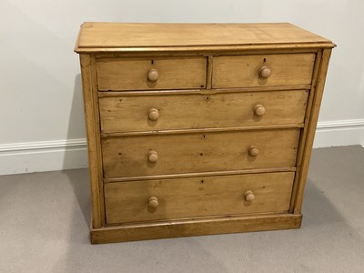 Lot 1111 - A late 19th century pine chest, of two short...