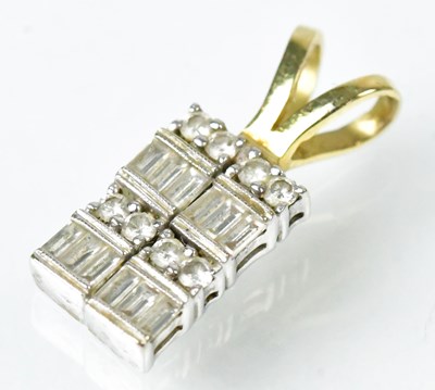 Lot 806 - A yellow and white metal rectangular pendant...