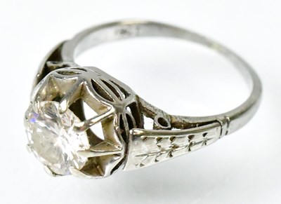 Lot 713 - An 18ct white gold solitaire ring set with a...