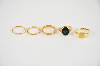 Lot 472 - Three 22ct yellow gold wedding bands, sizes O,...