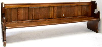 Lot 5 - A pitch pine church pew with Gothic-style ends,...