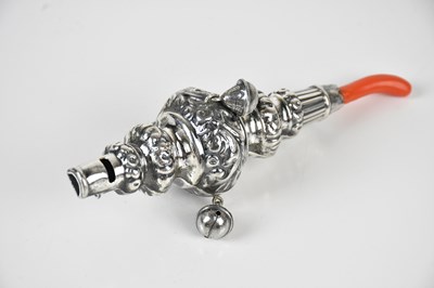 Lot 191 - An 800 grade silver baby's teething rattle,...
