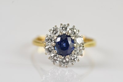 Lot 464 - A yellow metal diamond and sapphire cluster...