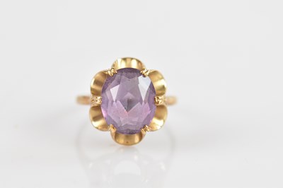 Lot 684 - A 9ct yellow gold dress ring set with an...