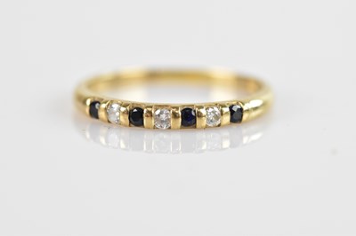 Lot 685 - A 9ct yellow gold half eternity ring, set with...