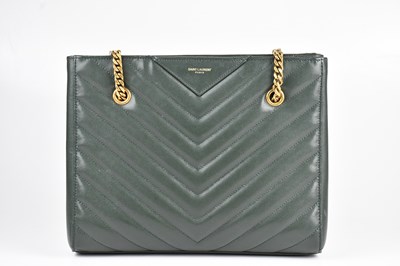 Lot 1404 - SAINT LAURENT, PARIS; a dark green grained...