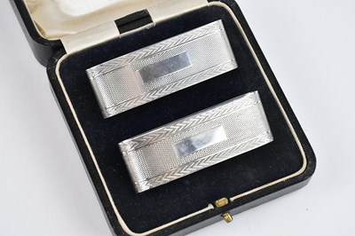 Lot 440 - A pair silver napkin rings