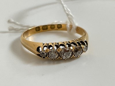 Lot 534 - An 18ct yellow gold and five stone graduated...