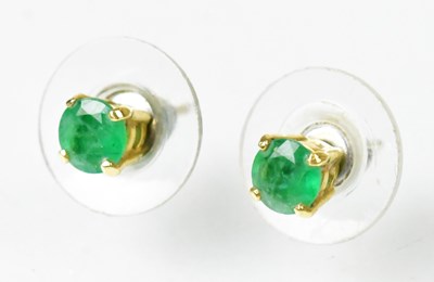 Lot 839 - A pair of yellow metal stud earrings set with...