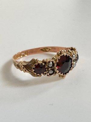 Lot 539 - A 9ct rose gold, garnet, and pearl ring, size...