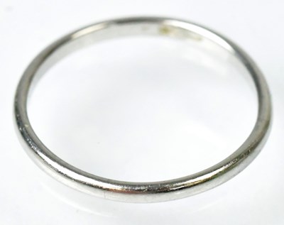 Lot 706 - A platinum wedding band, size N, approx. 2g.