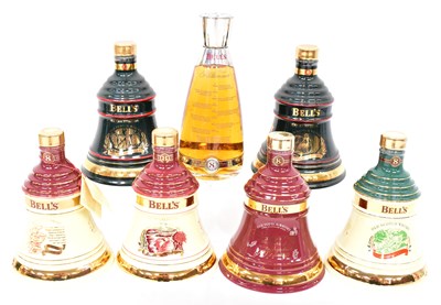 Lot 293 - BELL'S; seven boxed Scotch whisky decanters,...