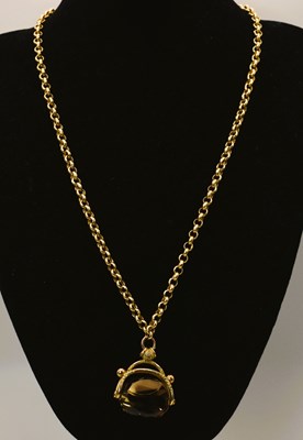Lot 565 - An 18ct gold necklace with a smoky quartz...