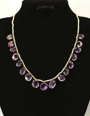 Lot 572 - A seed pearl and amethyst necklace, with an...