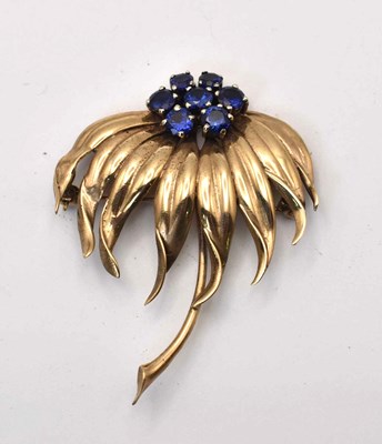 Lot 582 - A 9ct gold and sapphire floral spray brooch, 10g.