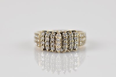 Lot 570 - A 9ct yellow gold diamond set stepped ring,...
