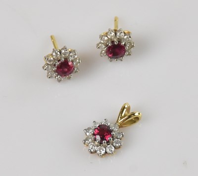 Lot 242 - A yellow and white metal three piece cluster...
