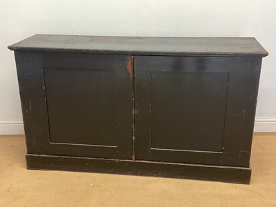 Lot 755 - A 19th century black painted pine cupboard...