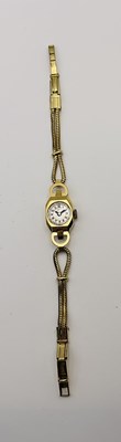 Lot 711 - An 18ct yellow gold lady's wristwatch,...