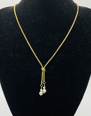 Lot 580 - A 14ct yellow gold necklace suspending four...