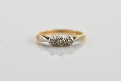 Lot 686 - A yellow and white metal diamond set three...