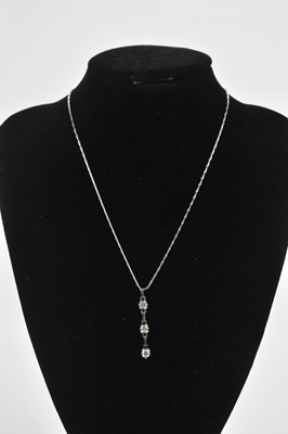 Lot 295 - An 18ct white gold diamond set pendant, set...