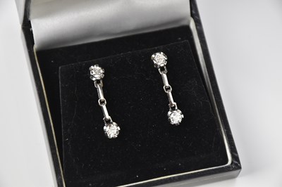 Lot 235 - A pair of 18ct white gold diamond drop...
