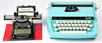 Lot 211 - A boxed 'Junior' typewriter, with original...