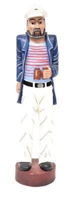 Lot 78 - A painted carved wooden figure of a sailor...