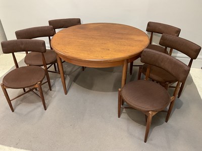 Lot 1011 - G PLAN; a mid century teak extending dining...