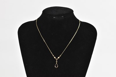 Lot 416 - A 9ct yellow gold fine link chain, suspending...