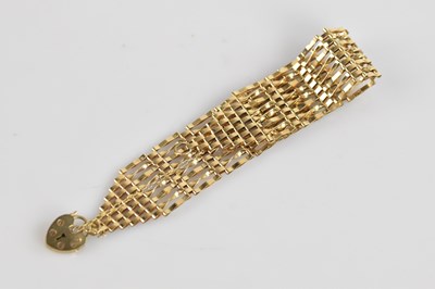 Lot 116 - A 9ct yellow gold gate link bracelet with 9ct...
