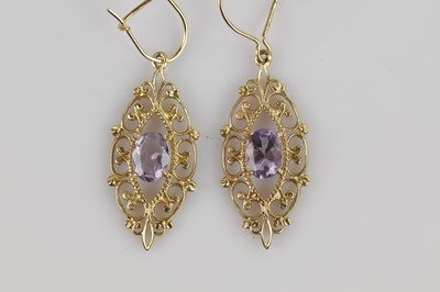 Lot 270 - A pair of yellow metal drop earrings set with...