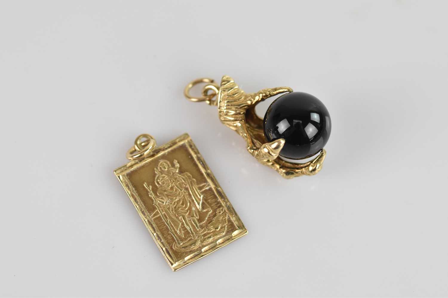 Lot 22 - A 9ct yellow gold St Christopher pendant and a...