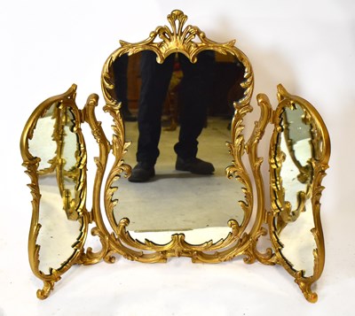 Lot 1761 - A gilt metal triptych folding dressing mirror