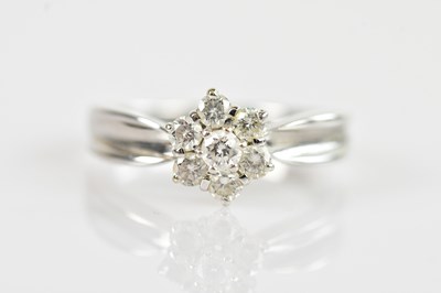 Lot 487 - An 18ct white gold daisy cluster ring set with...