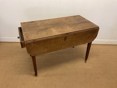 Lot 774 - A oak Pembroke table with drawers at both ends,...