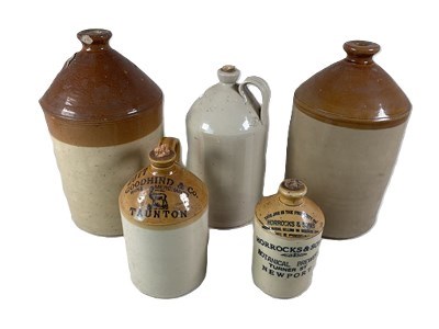 Lot 62 - Five stoneware flagons, including Goodhind and...
