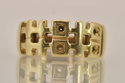 Lot 1366 - A 9ct yellow gold ring with a contemporary cut...