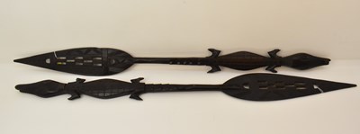 Lot 1063 - A pair of carved African tribal spears/paddles,...