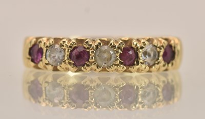 Lot 1398 - A 9ct yellow gold dress ring, with a row of...