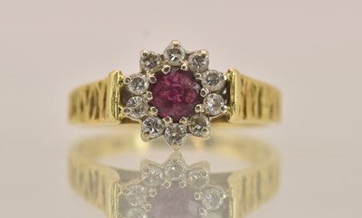 Lot 1348 - An 18ct yellow gold ring, with central claw...