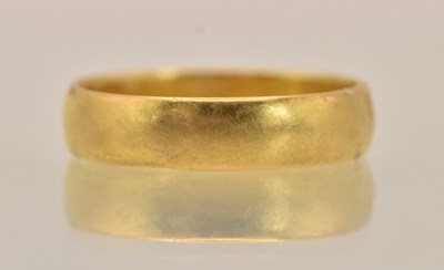Lot 1339 - A 22ct yellow gold band ring, size Q, approx 4....