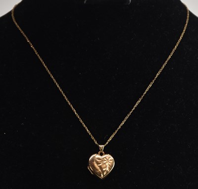 Lot 1472 - A 9ct yellow gold small heart shaped locket...