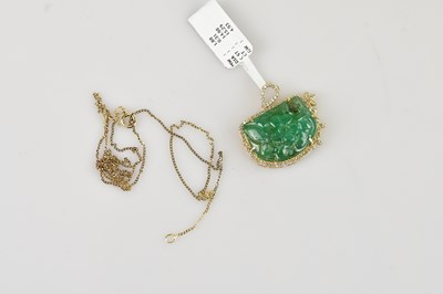Lot 316 - A yellow metal diamond and emerald pendant,...