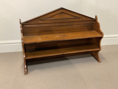 Lot 1144 - An early 20th century oak two tier shelf,...