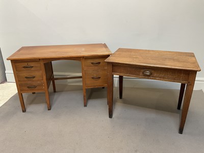Lot 1115 - An early 20th century oak desk with single...