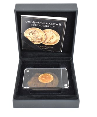 Lot 879 - An Elizabeth II 1966 sovereign, mounted in...