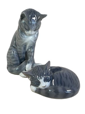 Lot 253 - ROYAL COPENHAGEN; two porcelain models of cats,...